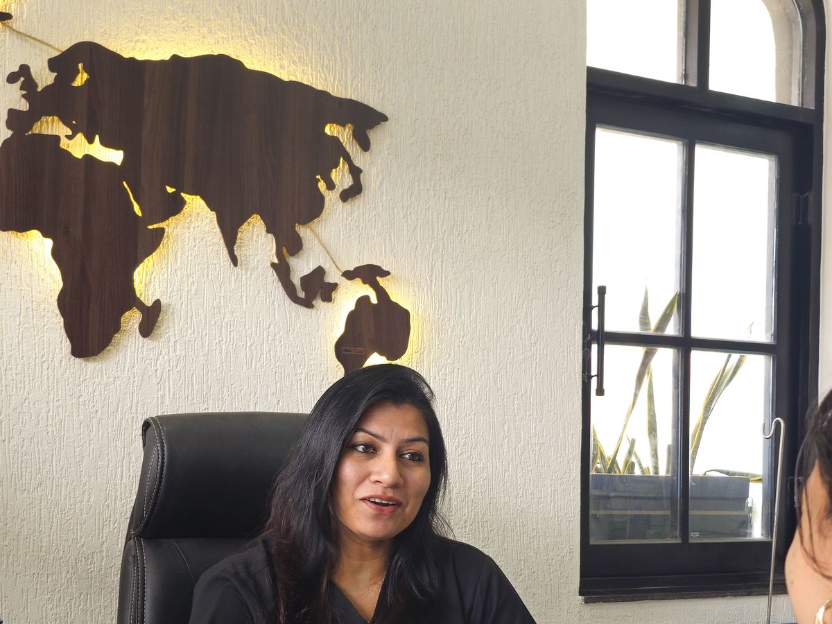 Dr. Yojna Shriwas in consultation with a patient at her desk