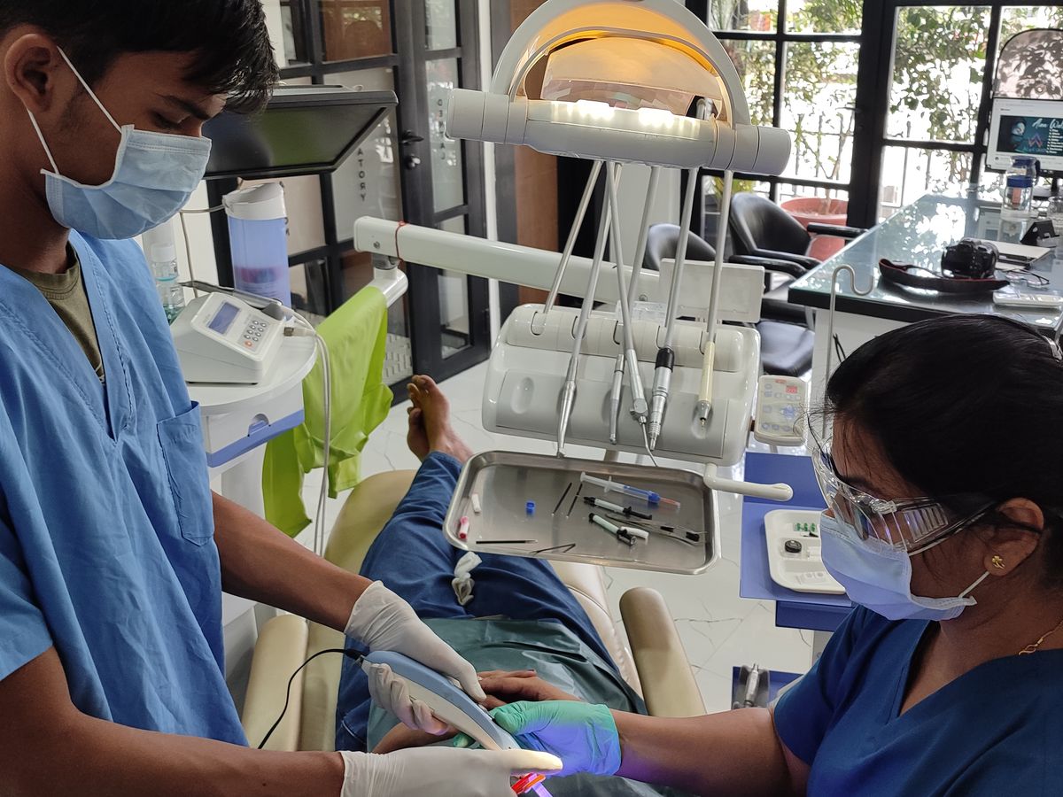 Light-curing composite during a veneer appointment — Dr. Yojna's Dental Clinic, Jaipur